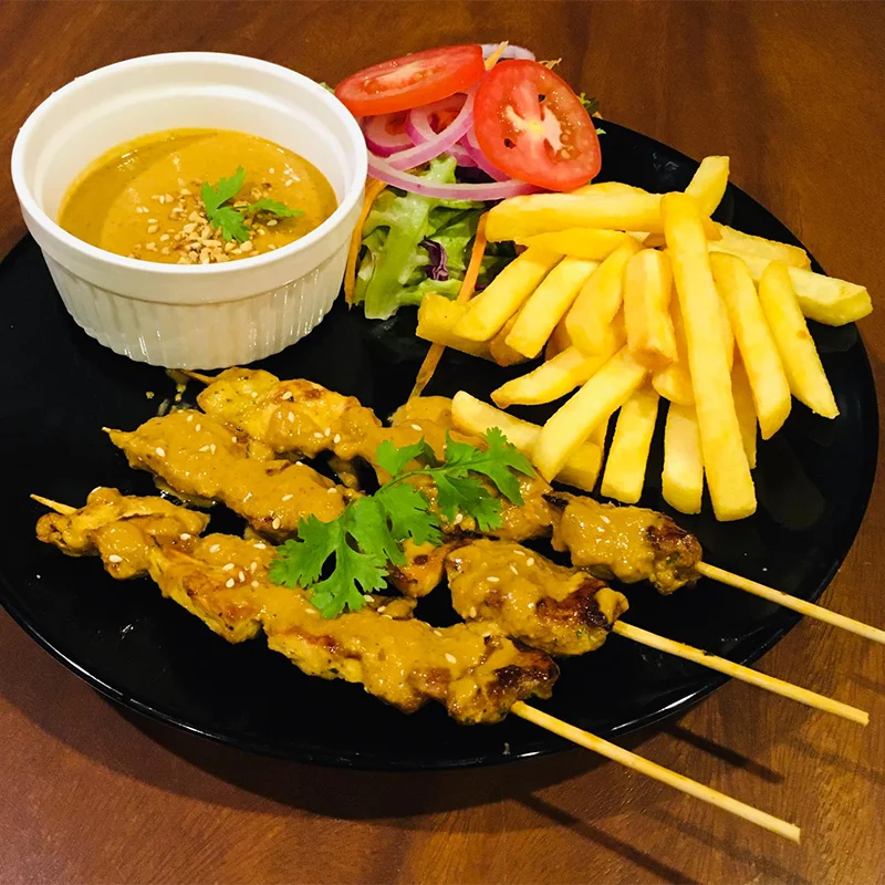 Chicken satay with peanut sauce and fries